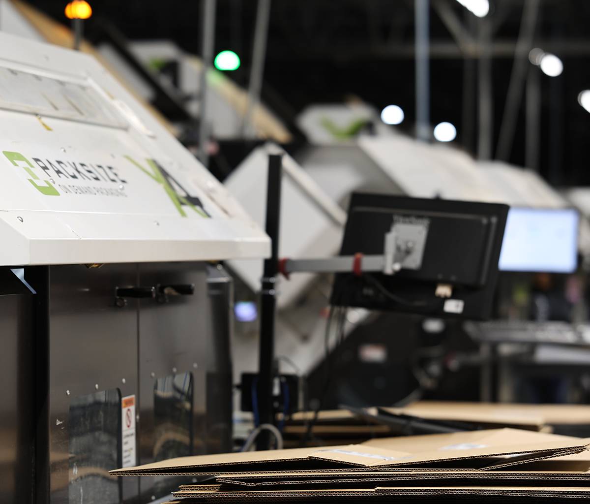 A photo of a group of Packsize X4 packaging machines at Staples